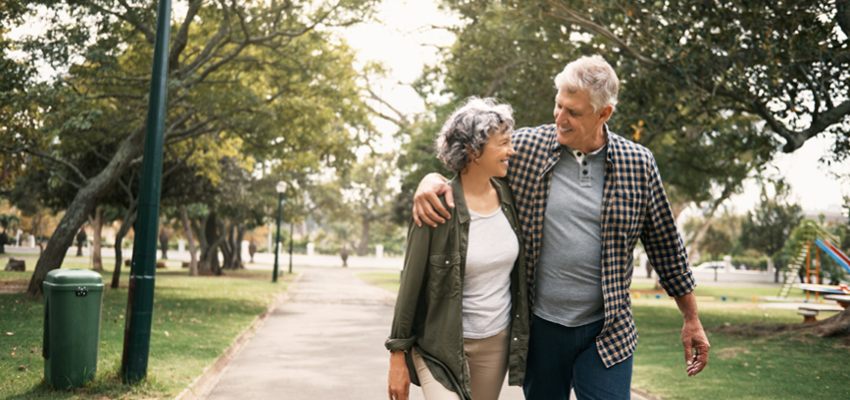 Older couple walking on the park
